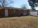 A spacious backyard with a brick building and a white fence at 637 Redwood Ave. # 1, Myrtle Beach, SC 29577