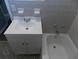 This bathroom showcases a tub, toilet, and vanity with sleek fixtures and tiled floor at 637 Redwood Ave. # 1, Myrtle Beach, SC 29577