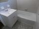 This is a bathroom featuring a vanity sink, bathtub with tile surround, and gray flooring at 637 Redwood Ave. # 1, Myrtle Beach, SC 29577