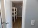 This is a walk-in closet, showcasing the shelves and storage options within the bedroom at 637 Redwood Ave. # 1, Myrtle Beach, SC 29577