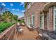 Relaxing brick patio in backyard with seating area and greenery at 707 Compass Pointe Dr, North Myrtle Beach, SC 29582