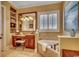 Bright bathroom featuring a soaking tub, tiled floors, a large mirror, and ample counter space at 707 Compass Pointe Dr, North Myrtle Beach, SC 29582
