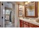 Bathroom featuring double vanity, framed mirror, and tub with shower head, lots of light at 707 Compass Pointe Dr, North Myrtle Beach, SC 29582