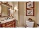 Bathroom with vanity, mirror, and toilet at 707 Compass Pointe Dr, North Myrtle Beach, SC 29582
