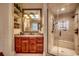 Elegant bathroom boasts a walk-in shower, granite countertops, double sinks, and a decorative mirror at 707 Compass Pointe Dr, North Myrtle Beach, SC 29582