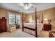 Comfortable bedroom featuring a four poster bed and neutral walls at 707 Compass Pointe Dr, North Myrtle Beach, SC 29582