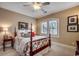 Cozy bedroom with shuttered windows, colorful bed linens, a ceiling fan, and decorative wall art at 707 Compass Pointe Dr, North Myrtle Beach, SC 29582
