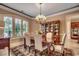 Dining room area with a chandelier, window, and china cabinet at 707 Compass Pointe Dr, North Myrtle Beach, SC 29582