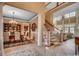 Elegant foyer with high ceilings, tile floors, staircase, and dining area at 707 Compass Pointe Dr, North Myrtle Beach, SC 29582
