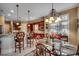 Elegant eat-in kitchen with a breakfast bar, chandelier, and plenty of natural light at 707 Compass Pointe Dr, North Myrtle Beach, SC 29582
