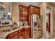 Well-lit kitchen with stainless steel refrigerator and a sink with granite countertops at 707 Compass Pointe Dr, North Myrtle Beach, SC 29582