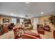 Spacious living room features a ceiling fan, carpet, and large windows at 707 Compass Pointe Dr, North Myrtle Beach, SC 29582