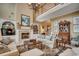 Cozy living room featuring a fireplace, built-in bookshelves, and comfortable seating at 707 Compass Pointe Dr, North Myrtle Beach, SC 29582