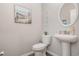 Charming powder room with a pedestal sink and nautical decor at 816 Wailea Circle, Little River, SC 29566