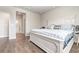 Bright bedroom with hardwood floors and a comfortable looking queen size bed at 816 Wailea Circle, Little River, SC 29566