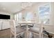 Bright breakfast nook with a round table, four chairs, and natural light at 816 Wailea Circle, Little River, SC 29566