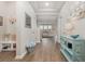 Well-lit entryway with hardwood floors and decorative wall art at 816 Wailea Circle, Little River, SC 29566