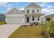Charming two-story home featuring a welcoming front porch and a well-maintained lawn at 816 Wailea Circle, Little River, SC 29566