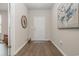 Foyer with hardwood floors, decorative accents, and natural lighting at 816 Wailea Circle, Little River, SC 29566