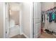 Hallway with views to bathroom and walk-in closet at 816 Wailea Circle, Little River, SC 29566