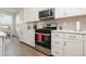 Modern kitchen featuring stainless steel appliances, subway tile backsplash, and abundant cabinet space at 816 Wailea Circle, Little River, SC 29566