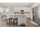 Modern kitchen featuring a center island with seating, stainless steel appliances, and bright, open design at 816 Wailea Circle, Little River, SC 29566
