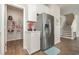 Well-organized kitchen featuring stainless steel refrigerator, pantry and easy access to the stairs at 816 Wailea Circle, Little River, SC 29566