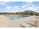 Community pool with lounge chairs and tables for residents to enjoy summer days at 816 Wailea Circle, Little River, SC 29566