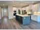 Modern kitchen with stainless appliances, quartz countertops, a kitchen island and pendant lighting at 9021 Aria Way, Longs, SC 29568