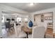 Open-concept dining room and living room with lots of natural light, neutral colors, and modern decor at 903 Agostino Dr., Myrtle Beach, SC 29579