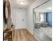 Bright entryway with wood-look floors leading into a living room with a blue accent wall at 903 Agostino Dr., Myrtle Beach, SC 29579