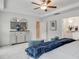 Spacious main bedroom suite offering accent furniture, neutral décor, ceiling fan, and an ensuite bathroom at 903 Agostino Dr., Myrtle Beach, SC 29579