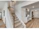 Staircase with carpeted steps and white wooden banister, leading up to the second floor at 903 Agostino Dr., Myrtle Beach, SC 29579