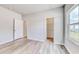 Bright bedroom features wood-look flooring, and has neutral walls with white trim at 915 Agostino Dr., Myrtle Beach, SC 29579