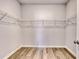 Walk-in closet featuring wood-look floors and wire shelving at 915 Agostino Dr., Myrtle Beach, SC 29579