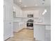 Modern kitchen features white cabinets, granite countertops, stainless steel appliances and a subway tile backsplash at 915 Agostino Dr., Myrtle Beach, SC 29579