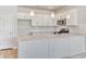 New kitchen with white cabinets, granite countertops, stainless steel appliances, and subway tile backsplash at 915 Agostino Dr., Myrtle Beach, SC 29579