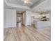 Bright, open living space with wood-look flooring, seamlessly connecting the kitchen and living areas at 915 Agostino Dr., Myrtle Beach, SC 29579