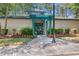 Front entrance to the amenity center with a decorative pergola and landscaping at 1001 Brantley L Brantley Ln., North Myrtle Beach, SC 29582