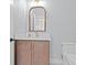 Elegant powder room featuring a stylish vanity with a gold-trimmed mirror at 1001 Brantley L Brantley Ln., North Myrtle Beach, SC 29582