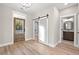 Bright foyer with wood floors, barn door, and view of the hall bathroom at 1001 Brantley L Brantley Ln., North Myrtle Beach, SC 29582