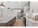 Spacious kitchen with stainless appliances, large island, granite counters, and modern lighting at 1001 Brantley L Brantley Ln., North Myrtle Beach, SC 29582