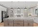 Gorgeous kitchen island with granite counters, modern lighting, and stainless appliances at 1001 Brantley L Brantley Ln., North Myrtle Beach, SC 29582
