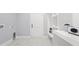 Functional laundry room featuring marble tile floor, storage shelves and modern amenities at 1001 Brantley L Brantley Ln., North Myrtle Beach, SC 29582