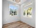 Well-lit office space with wood floors and two large windows with views of the neighborhood at 1001 Brantley L Brantley Ln., North Myrtle Beach, SC 29582