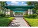 Entrance to the tennis center with a covered pergola and manicured landscaping at 1001 Brantley L Brantley Ln., North Myrtle Beach, SC 29582