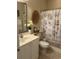 Cozy bathroom with decorative shower curtain and basket decor, creating a warm and inviting atmosphere at 1001 Ray Costin Way # 1605, Murrells Inlet, SC 29576