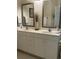 Bright bathroom featuring double sinks, elegant mirrors, and neutral countertops providing a serene and functional space at 1001 Ray Costin Way # 1605, Murrells Inlet, SC 29576