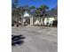 Charming building exterior with palm trees, handicap parking, and inviting entrance area at 1001 Ray Costin Way # 1605, Murrells Inlet, SC 29576