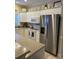 Bright kitchen with white cabinets, modern stainless steel appliances, and ample counter space for meal preparation at 1001 Ray Costin Way # 1605, Murrells Inlet, SC 29576